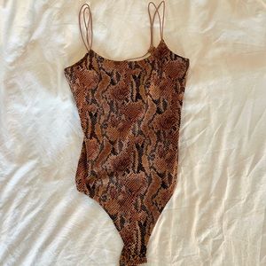 Open back snake skin body suit